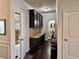 Functional mudroom with built-in cabinets, countertop space, and stylish tile accents at 2359 Brynfield Cv, Suwanee, GA 30024