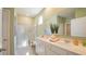 Bright bathroom featuring a double vanity, glass-enclosed shower, and modern fixtures at 2402 Bayberry St, Acworth, GA 30101