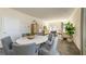 Open-concept dining area with a modern table set, stylish chairs, and a seamless transition to the living space at 2402 Bayberry St, Acworth, GA 30101