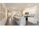 Spacious kitchen boasts stainless steel appliances, quartz countertops, an island with seating, and a modern design at 2402 Bayberry St, Acworth, GA 30101