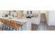 Bright kitchen featuring a large island with barstool seating, modern appliances, and ample countertop space at 2402 Bayberry St, Acworth, GA 30101