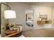 Bright sitting area featuring stylish chairs, a side table, and a view to the bedroom at 2402 Bayberry St, Acworth, GA 30101