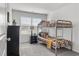 Shared bedroom with a bunk bed, carpeted floor, and a black dresser at 7015 Old Bridge Ln, Conyers, GA 30013