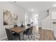 Dining room with a rustic wooden table and chairs, adjacent to the kitchen at 7015 Old Bridge Ln, Conyers, GA 30013