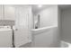 Upstairs laundry area with modern washer and dryer at 7015 Old Bridge Ln, Conyers, GA 30013