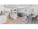 Open-concept floor plan with a modern kitchen, cozy living room, and dining area at 7015 Old Bridge Ln, Conyers, GA 30013