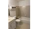 Standard bathroom featuring a combined tub and shower, toilet, and vanity with drawers at 1101 Mcgill Park Ne Ave # 1101, Atlanta, GA 30312