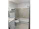Standard bathroom with a combined tub and shower, toilet, and vanity with drawers for storage at 1101 Mcgill Park Ne Ave # 1101, Atlanta, GA 30312