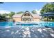 Community pool with lounge seating surrounded by trees and clear blue skies at 1101 Mcgill Park Ne Ave # 1101, Atlanta, GA 30312