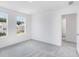 Well-lit bedroom boasts carpet and windows with neighborhood views at 204 Groveton Ct, Euharlee, GA 30145