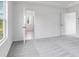 Bedroom with carpeted floors, neutral colored walls, and view to the backyard at 204 Groveton Ct, Euharlee, GA 30145