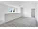 Bonus room featuring neutral-colored walls, carpet, and access to the staircase at 204 Groveton Ct, Euharlee, GA 30145