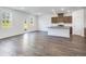 Spacious kitchen featuring granite countertops, stainless steel appliances, dark wood cabinets, and ample light at 204 Groveton Ct, Euharlee, GA 30145