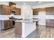 Bright kitchen with granite countertops, stainless steel appliances, and wooden cabinets at 204 Groveton Ct, Euharlee, GA 30145