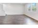 Living room featuring wood-look flooring, recessed lighting and bright windows at 204 Groveton Ct, Euharlee, GA 30145