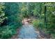 Gravel walking trail with wooden bridge feature surrounded by lush greenery at 4015 Sierra Vista Cir, Cumming, GA 30028