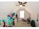 Attic featuring vaulted ceilings, neutral paint, and a ceiling fan with room for storage and workout space at 581 Victorian Cir, Dallas, GA 30157