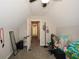 Attic featuring vaulted ceilings, neutral paint, and a ceiling fan with storage space at 581 Victorian Cir, Dallas, GA 30157