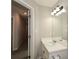 Bathroom featuring a single sink, white cabinets and plenty of bright lighting at 581 Victorian Cir, Dallas, GA 30157