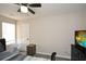 Bedroom features neutral walls, dark wood furniture and a ceiling fan at 581 Victorian Cir, Dallas, GA 30157