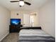 Bedroom with modern TV, ceiling fan and neutral walls at 581 Victorian Cir, Dallas, GA 30157