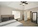 Neutral-colored bedroom featuring a ceiling fan with a view of the bathroom at 581 Victorian Cir, Dallas, GA 30157