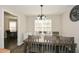 Inviting dining area with rustic table, ample seating, and natural light at 581 Victorian Cir, Dallas, GA 30157