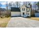 Charming two-story home with a two-car garage and a well-maintained front yard at 581 Victorian Cir, Dallas, GA 30157