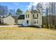 Charming two-story home with a two-car garage and a well-maintained front yard at 581 Victorian Cir, Dallas, GA 30157