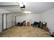 Spacious garage filled with storage items, featuring an automatic garage door at 581 Victorian Cir, Dallas, GA 30157
