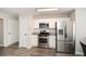 Kitchen featuring stainless steel appliances, white cabinets, and granite countertops at 581 Victorian Cir, Dallas, GA 30157