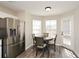 Eat-in kitchen features stainless appliances and a dining area at 581 Victorian Cir, Dallas, GA 30157