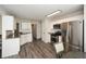 Bright kitchen with stainless steel appliances, white cabinets, and granite countertops at 581 Victorian Cir, Dallas, GA 30157
