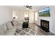 Spacious living room featuring a fireplace, providing a view into the adjacent dining area at 581 Victorian Cir, Dallas, GA 30157