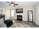 Bright and airy living room featuring a fireplace, ceiling fan, and modern furnishings at 581 Victorian Cir, Dallas, GA 30157