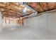 Unfinished basement featuring exposed beams and ductwork, and ready for customization at 602 Kenion Forest Way, Lilburn, GA 30047