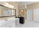 Bathroom area featuring a single sink vanity and a large framed mirror at 602 Kenion Forest Way, Lilburn, GA 30047