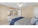 Bedroom featuring neutral walls, a large dresser, and a ceiling fan to keep you cool and comfortable at 602 Kenion Forest Way, Lilburn, GA 30047