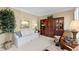 Cozy living room with neutral tones, plush seating, and a large built-in cabinet at 602 Kenion Forest Way, Lilburn, GA 30047