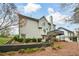 Home's back exterior showcases multi-level deck and landscaped yard at 608 Ridge Crossing Dr, Woodstock, GA 30189