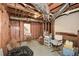 Unfinished basement area with exposed beams, ductwork, and a window, offering potential for customization at 608 Ridge Crossing Dr, Woodstock, GA 30189