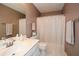 The secondary bath offers a bright vanity and tub with shower at 608 Ridge Crossing Dr, Woodstock, GA 30189