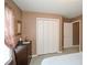 The main bedroom is completed with a dresser and closet at 608 Ridge Crossing Dr, Woodstock, GA 30189