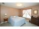 Serene bedroom with soft lighting and a view of the outdoors at 608 Ridge Crossing Dr, Woodstock, GA 30189