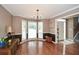 Elegant dining room featuring hardwood floors and large windows for natural light at 608 Ridge Crossing Dr, Woodstock, GA 30189