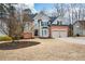 Charming two-story home with a well-manicured front yard and attached two-car garage at 608 Ridge Crossing Dr, Woodstock, GA 30189