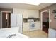 Functional kitchen featuring white cabinets, a gas range, and neutral tile flooring at 608 Ridge Crossing Dr, Woodstock, GA 30189