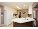 Well-lit kitchen with white cabinets, appliances, and an island with white countertops at 608 Ridge Crossing Dr, Woodstock, GA 30189