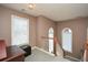 Bright landing area with natural light streaming through the windows and views of the stairway at 608 Ridge Crossing Dr, Woodstock, GA 30189