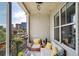 Relaxing outdoor balcony featuring comfortable seating, neutral tones, a colorful rug, and a pleasant city view at 625 Piedmont Ne Ave # 3028, Atlanta, GA 30308